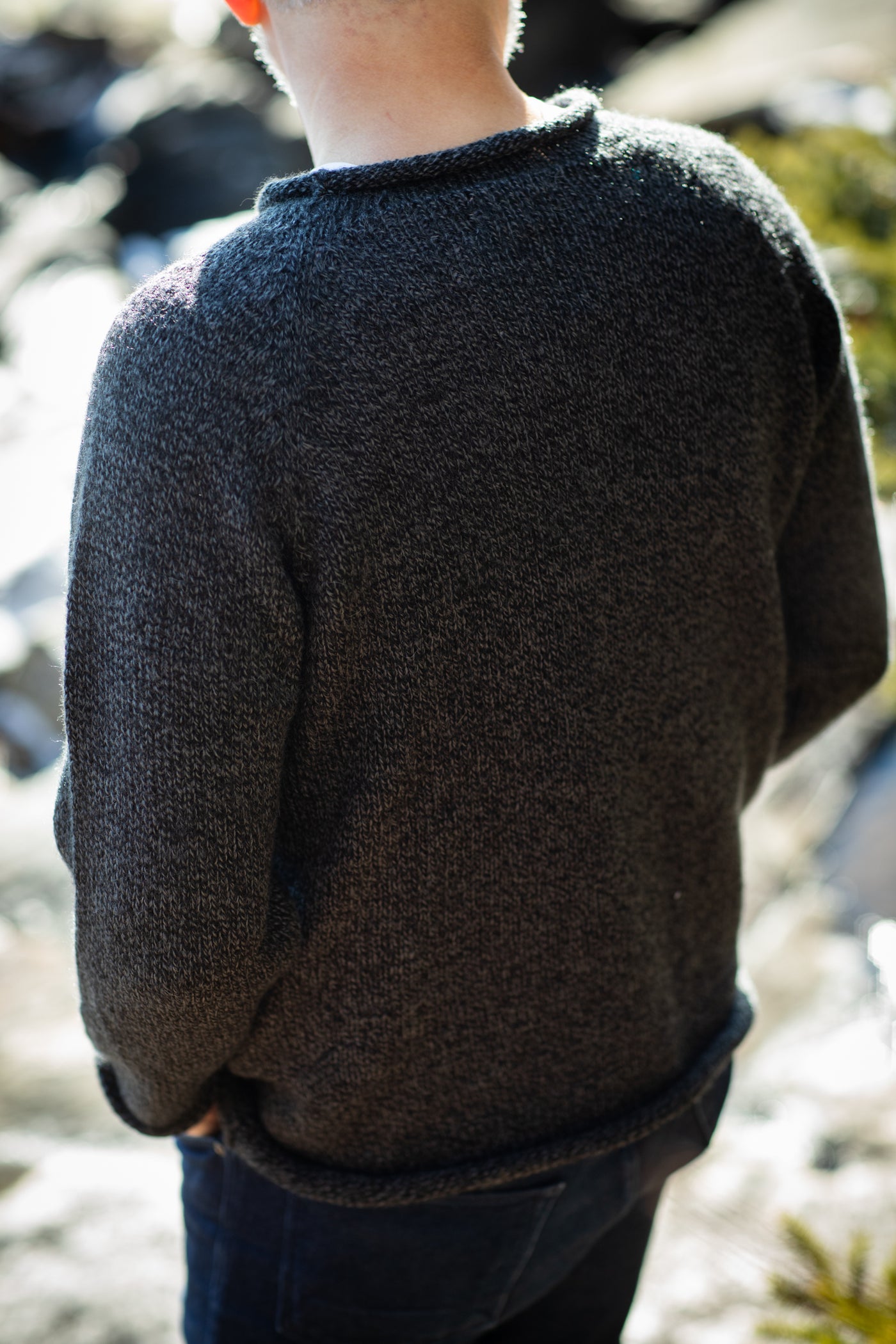 Michael is wearing size L roll neck alpaca sweater in charcoal
