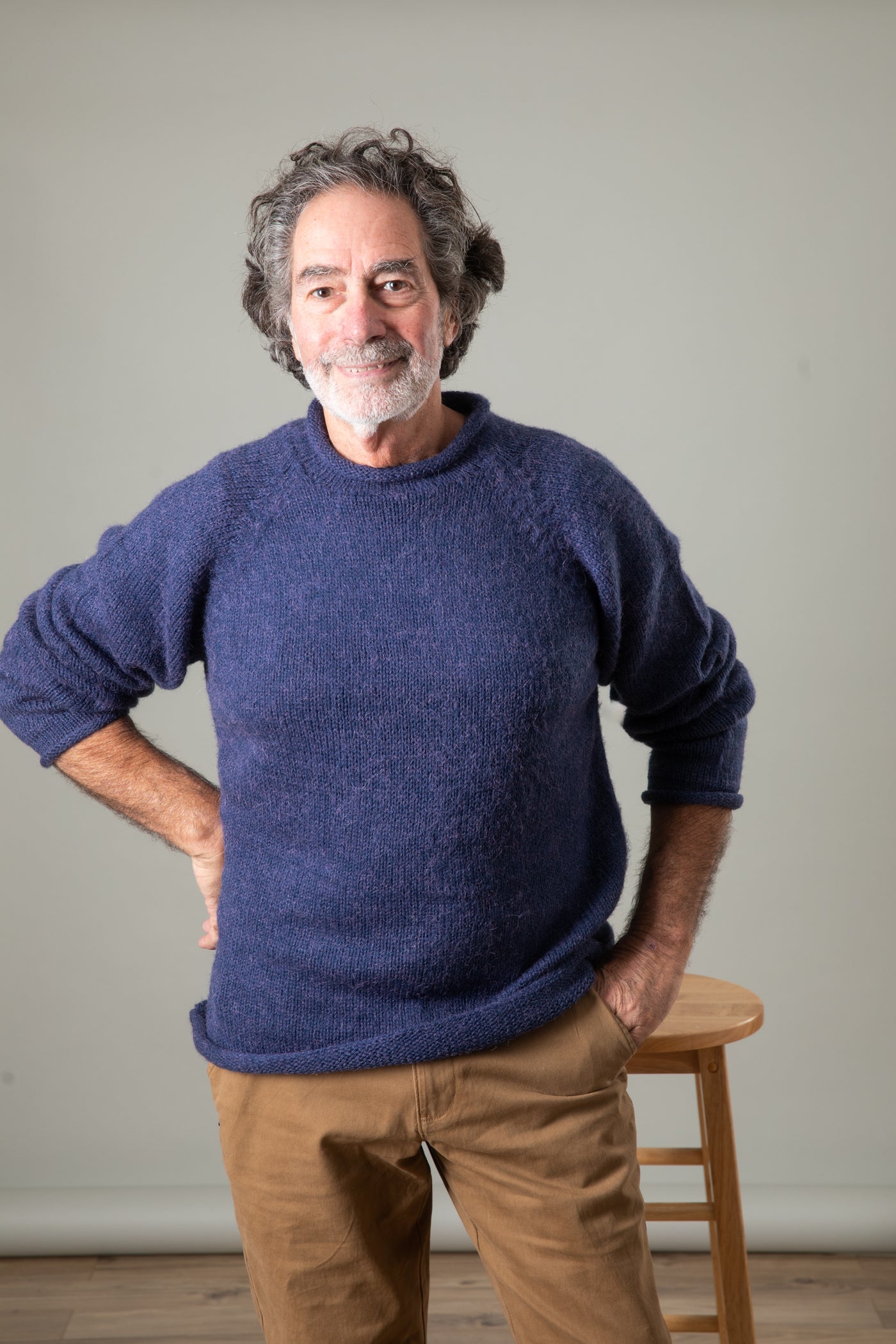 Bernie is wearing size L roll neck alpaca sweater in denim