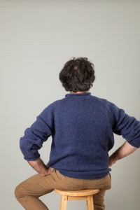Bernie is wearing size L roll neck alpaca sweater in denim
