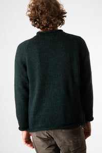 Ryan is wearing size XL roll neck alpaca sweater in forest