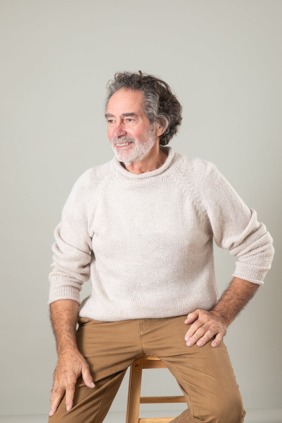 Bernie is wearing size L roll neck alpaca sweater in oatmeal