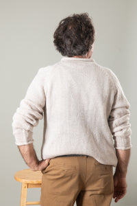Bernie is wearing size L roll neck alpaca sweater in oatmeal