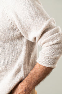Bernie is wearing size L roll neck alpaca sweater in oatmeal