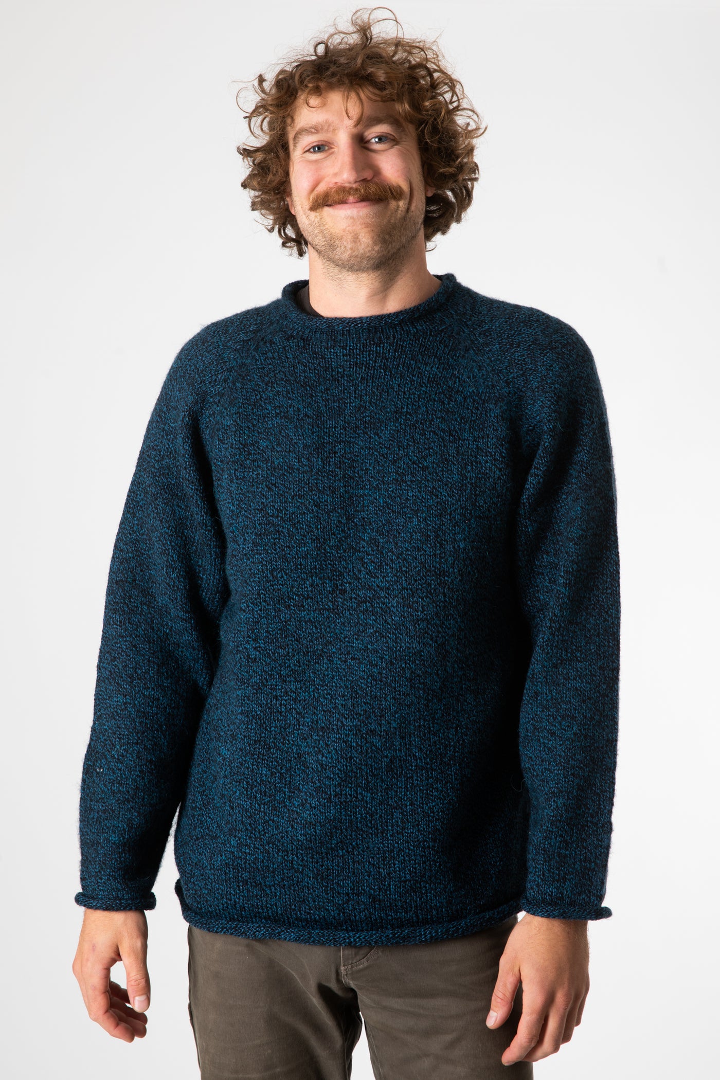 Ryan is wearing size XL roll neck alpaca sweater in navy