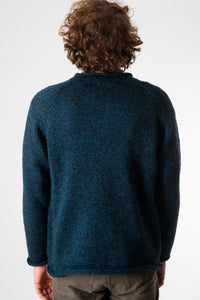 Ryan is wearing size XL roll neck alpaca sweater in navy