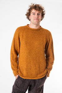 Ryan is wearing size XL roll neck alpaca sweater in sunflower