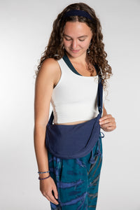 Emily is wearing the Samui Shoulder Bag in Navy