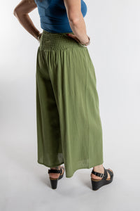 Susan is wearing the Saramati Palazzo Pants  in Green in L/XL