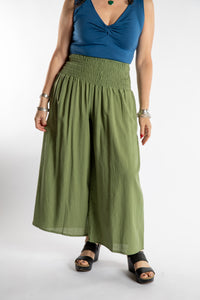 Susan is wearing the Saramati Palazzo Pants  in Green in L/XL