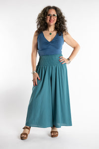 Susan is wearing the Saramati Palazzo Pants  in Teal in L/XL
