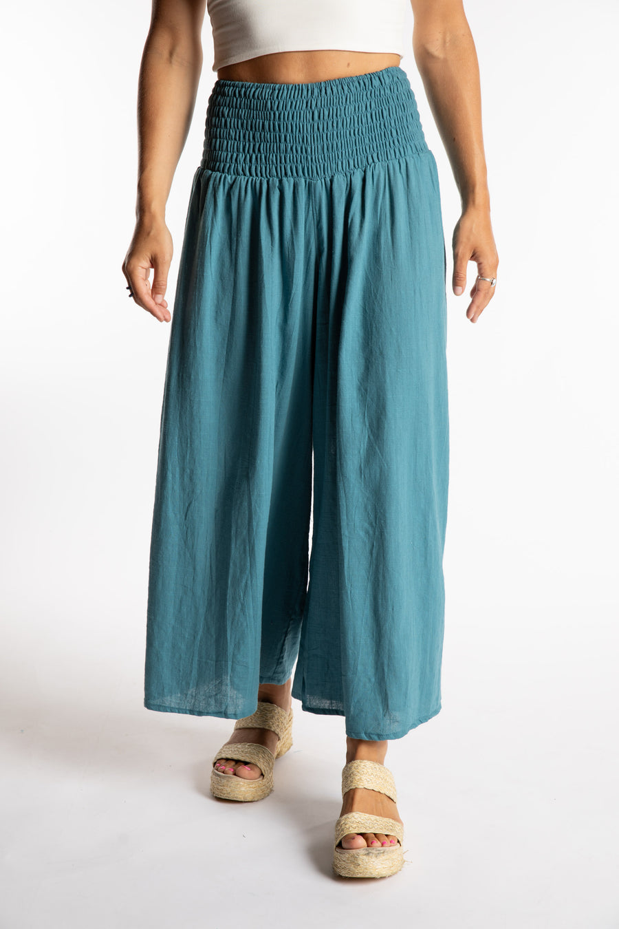 Sophie is wearing the Saramati Cotton Palazzo Pants in Teal S/M