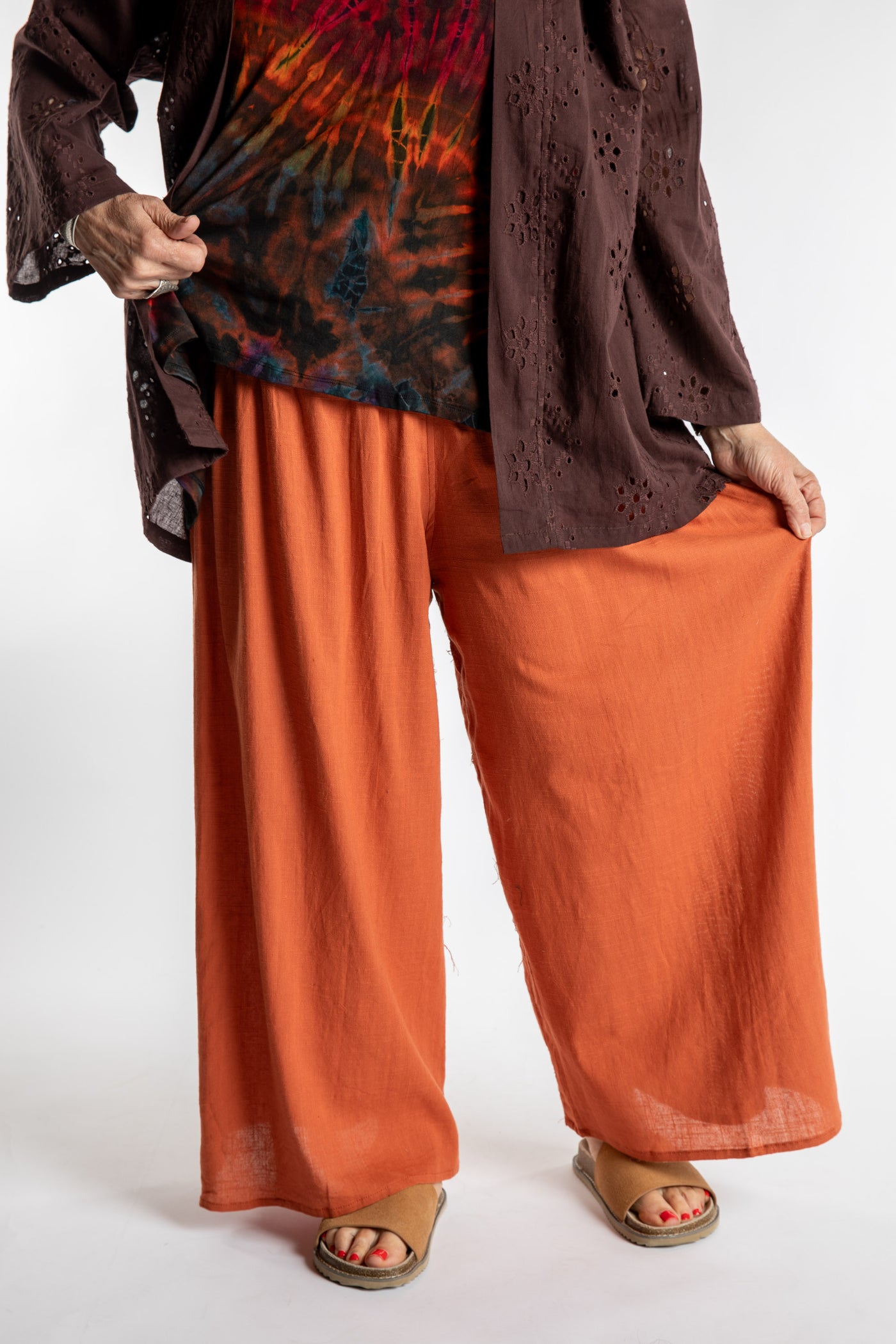 Betty is wearing the Saramati Palazzo Pants  in Terracotta in L/XL