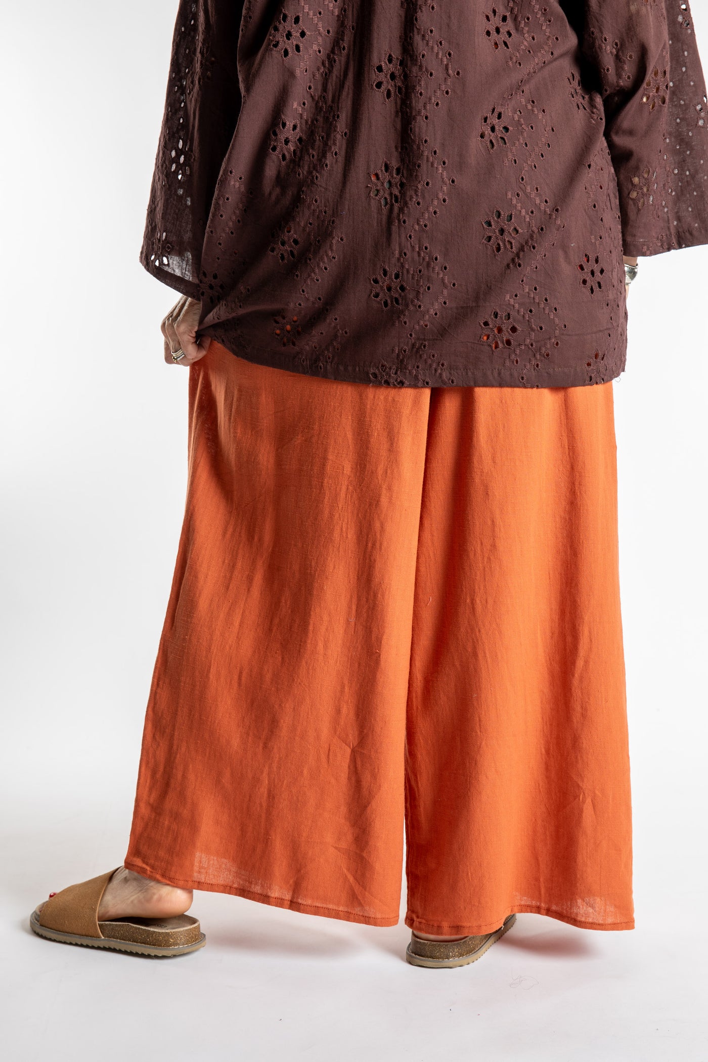 Betty is wearing the Saramati Palazzo Pants  in Terracotta in L/XL