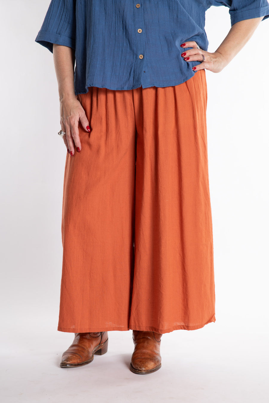 Susan is wearing the Saramati Cotton Palazzo Pants in Terracotta