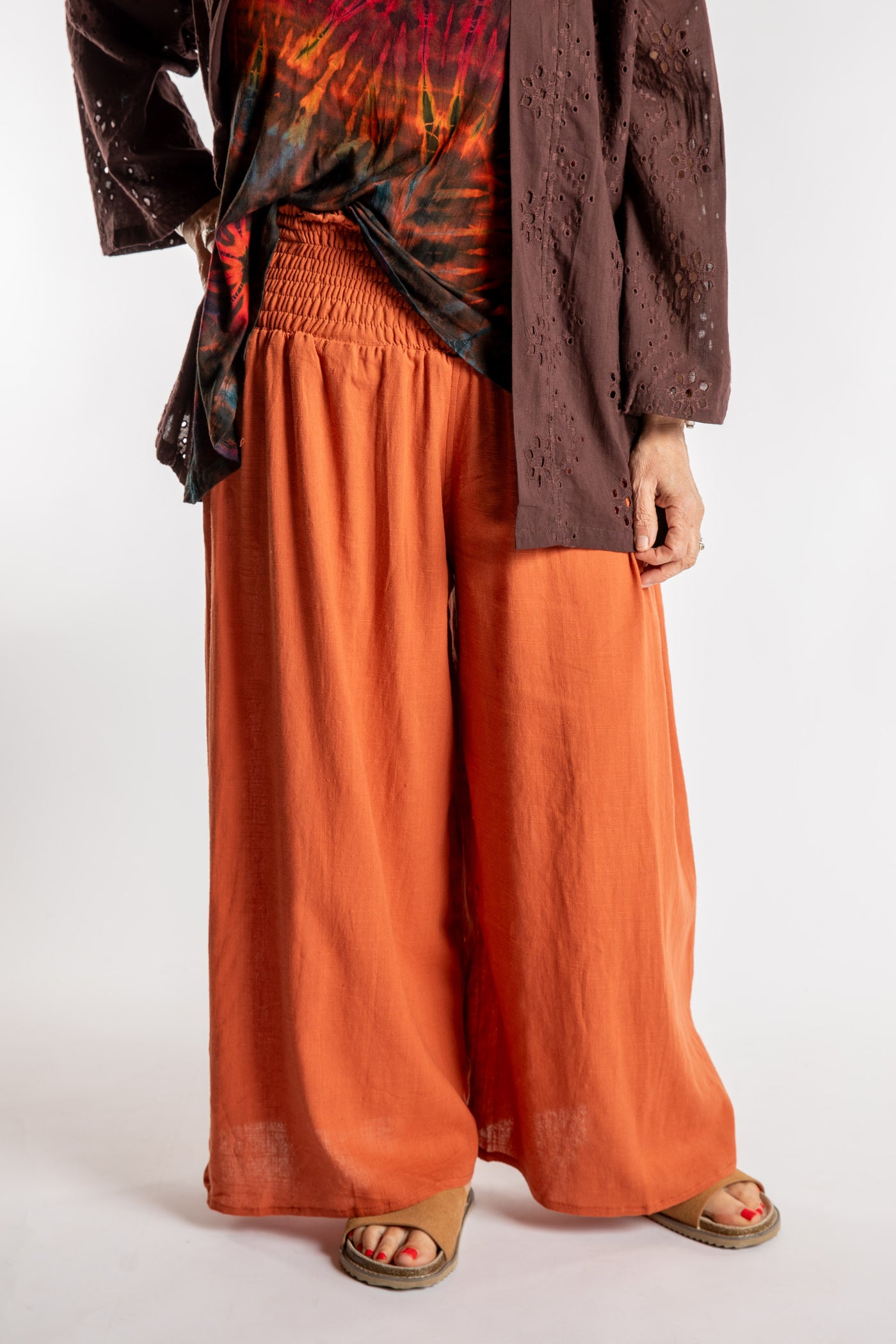 Betty is wearing the Saramati Palazzo Pants  in Terracotta in L/XL