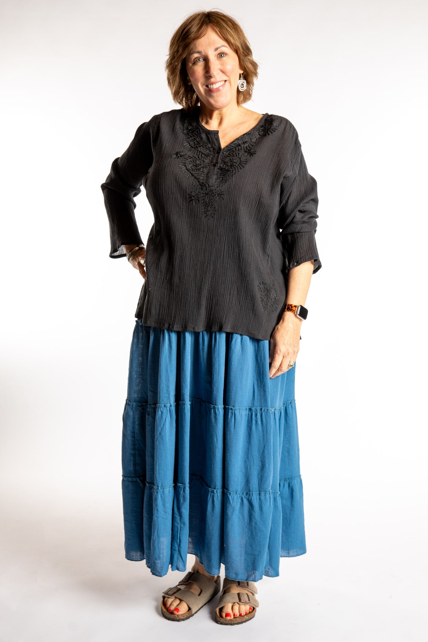 Betty is wearing the Saramati Prairie Skirt in one size in Blue