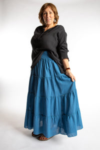 Betty is wearing the Saramati Prairie Skirt in one size in Blue