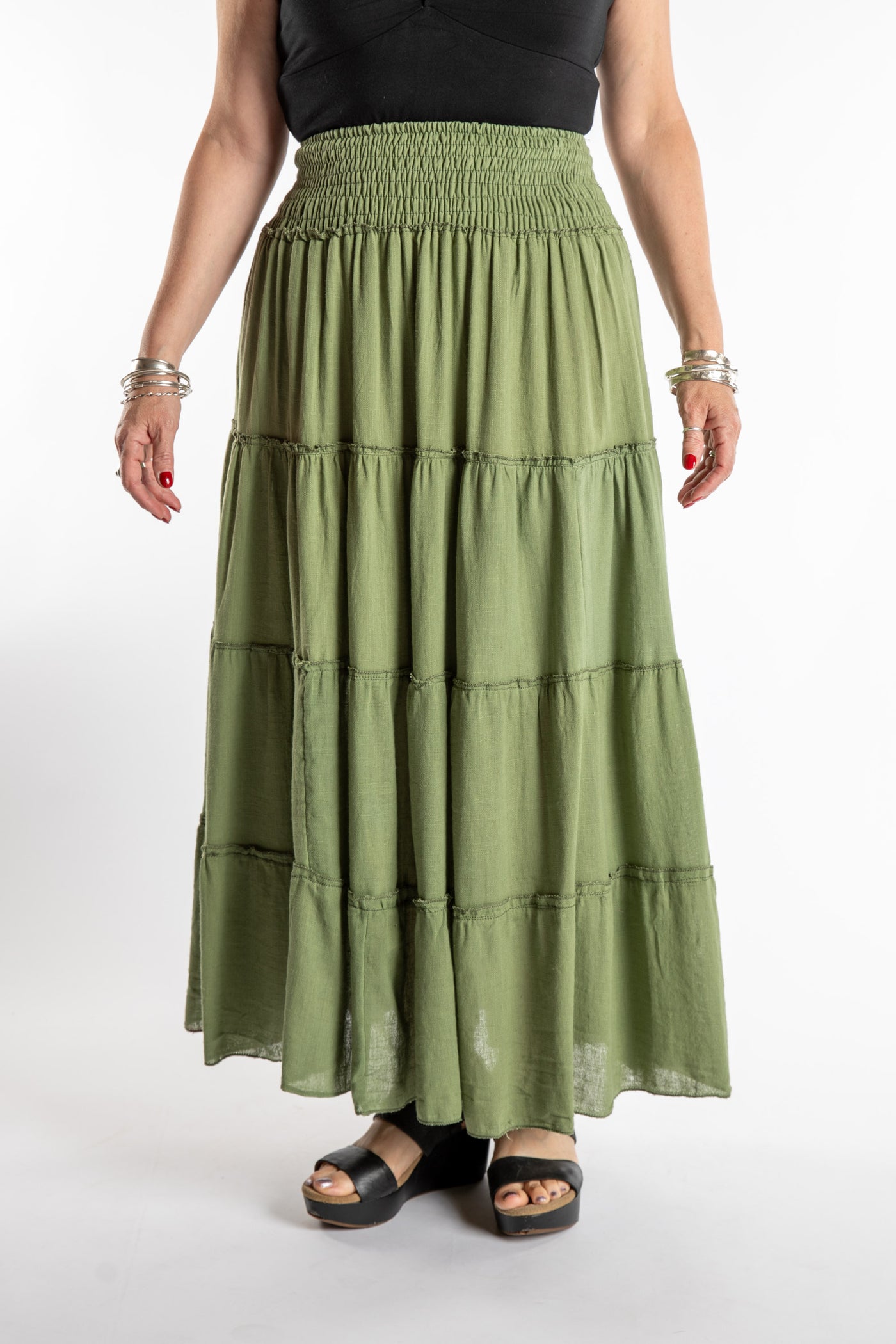Susan is wearing the Saramati Prairie Skirt in one size in Green