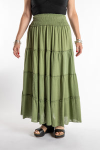 Susan is wearing the Saramati Prairie Skirt in one size in Green