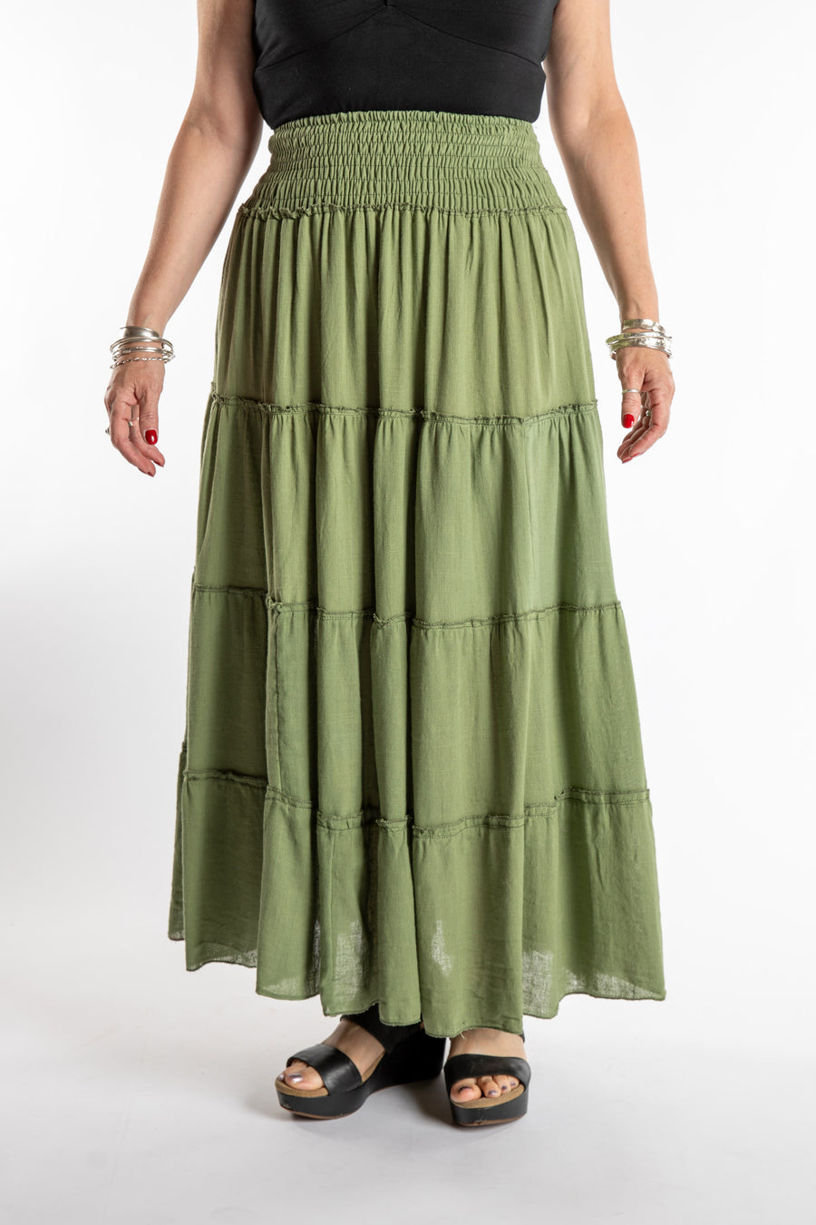 Susan is wearing the Saramati Prairie Skirt in one size in Green