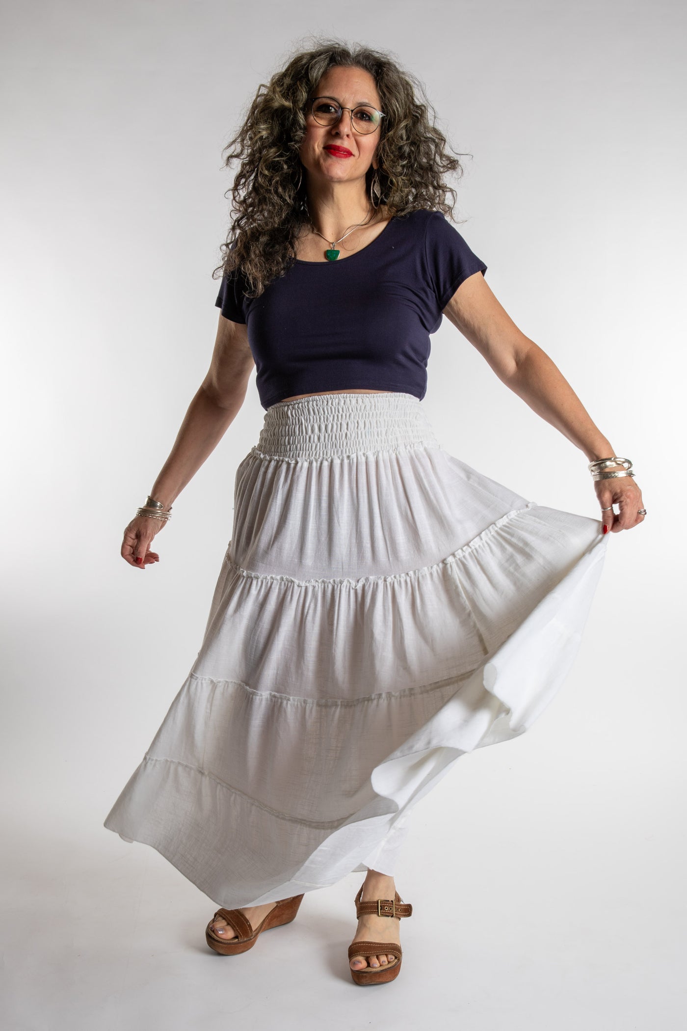 Susan is wearing the Saramati Prairie Skirt in one size in Ivory