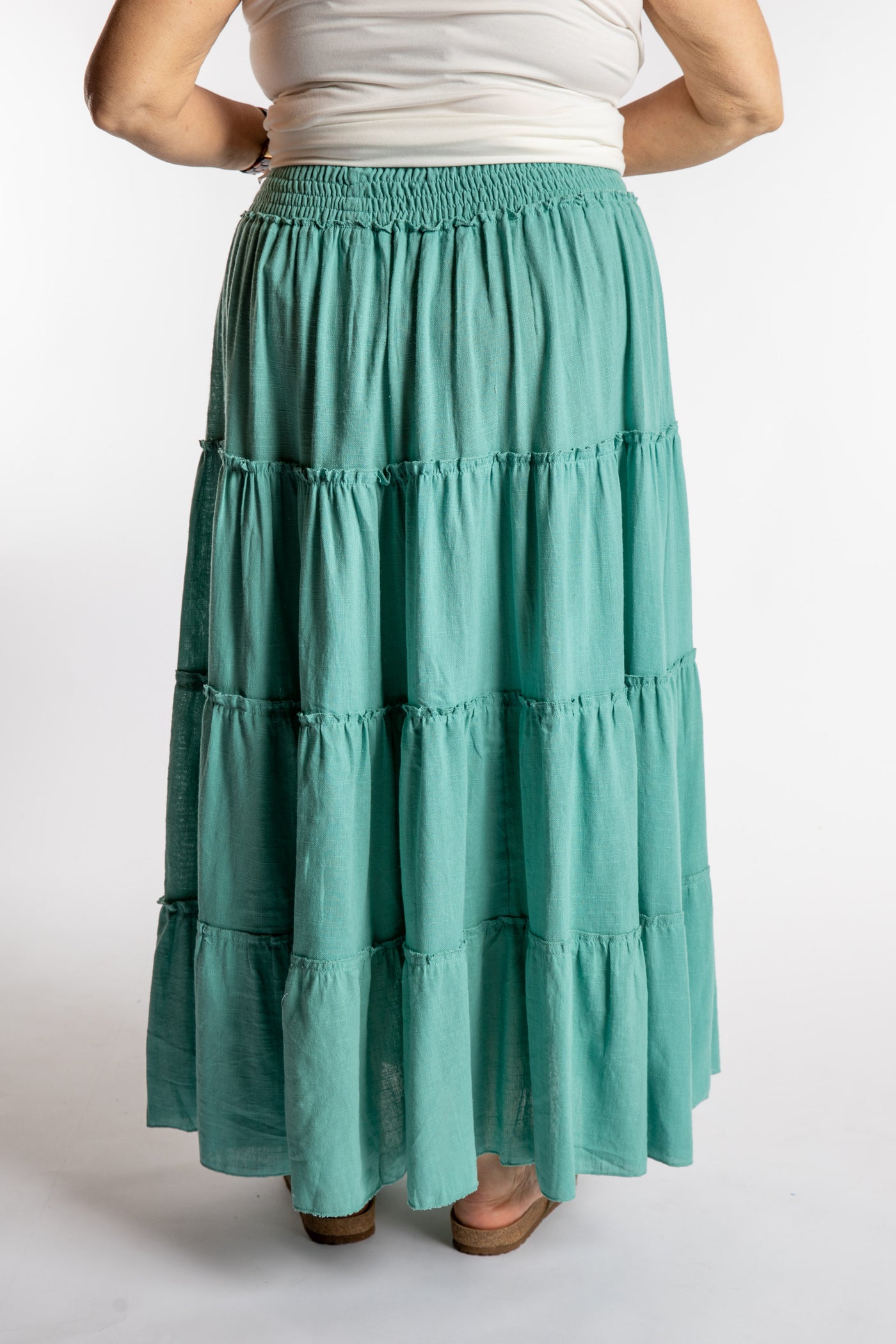 Betty is wearing the Saramati Prairie Skirt in one size in Mint