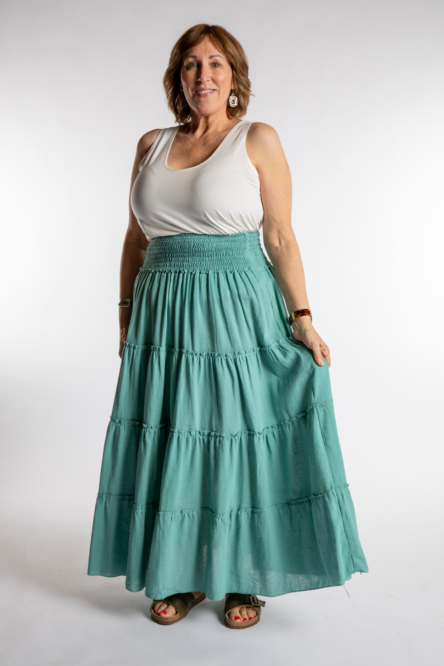 Betty is wearing the Saramati Prairie Skirt in one size in Mint