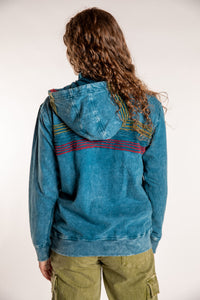 Emily is wearing the Blue Sathi Stripe ZIp Hoodie in Small