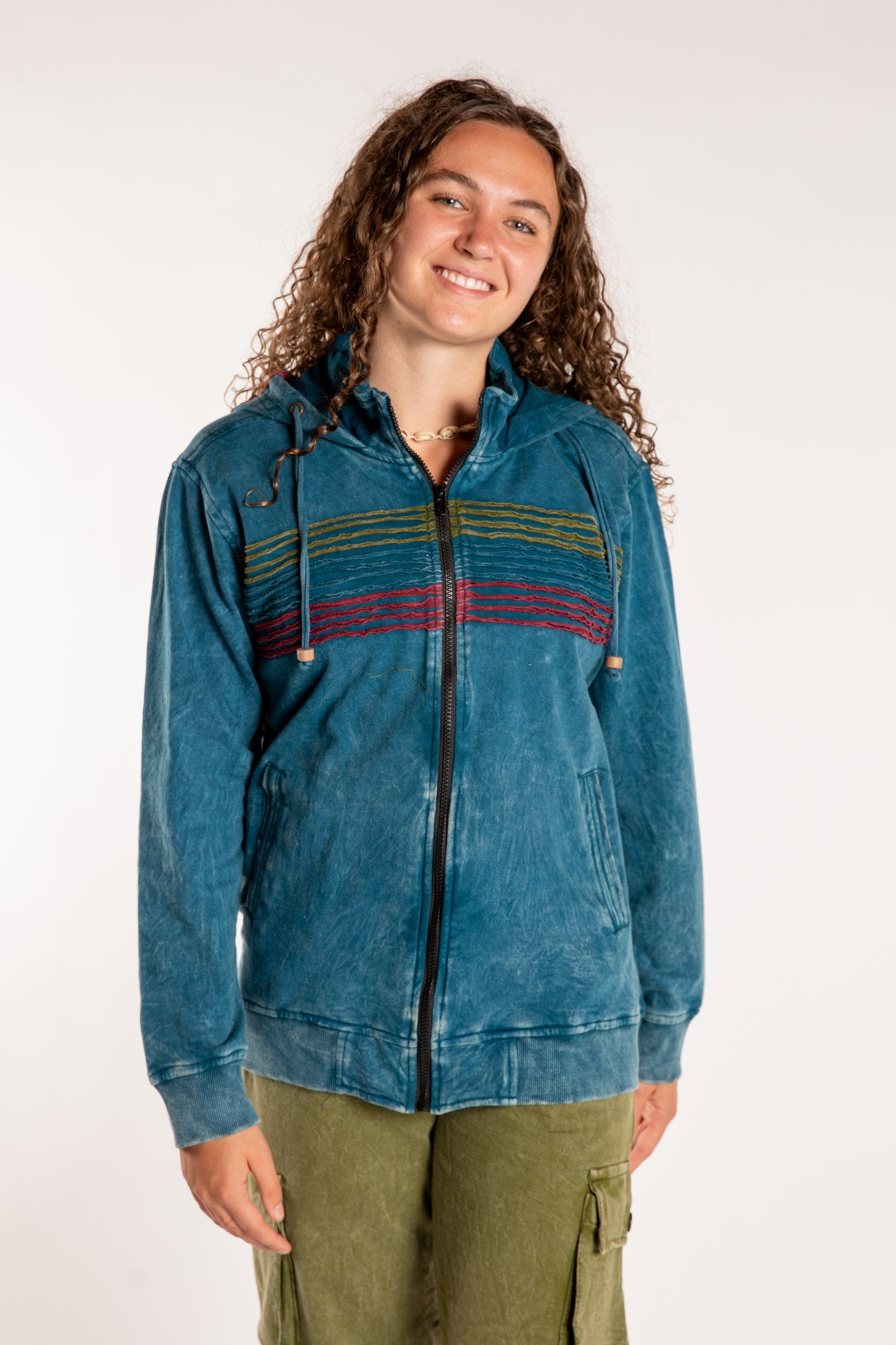 Emily is wearing the Blue Sathi Stripe ZIp Hoodie in Small
