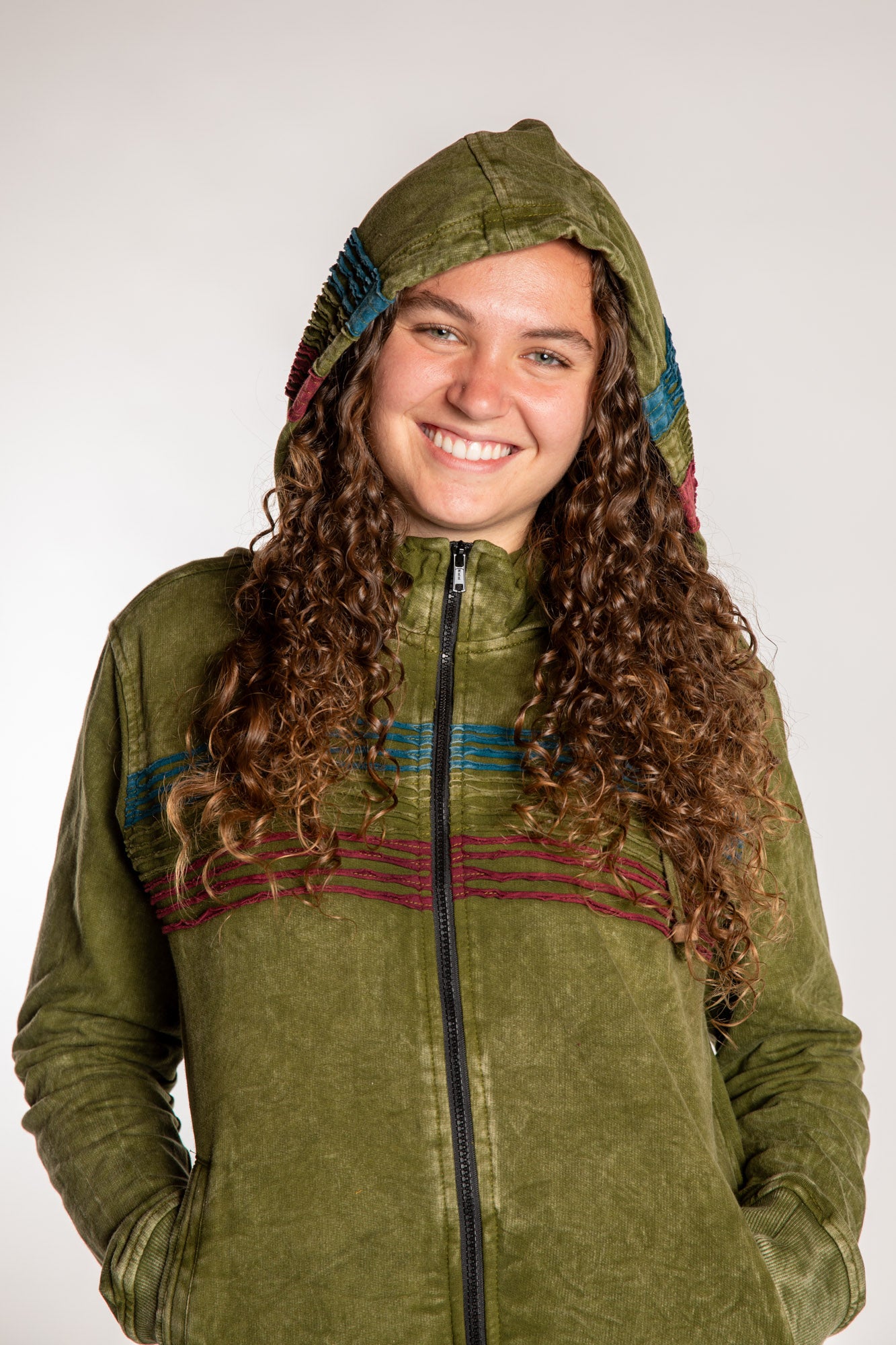 Emily is wearing the Olive Sathi Stripe ZIp Hoodie in Small