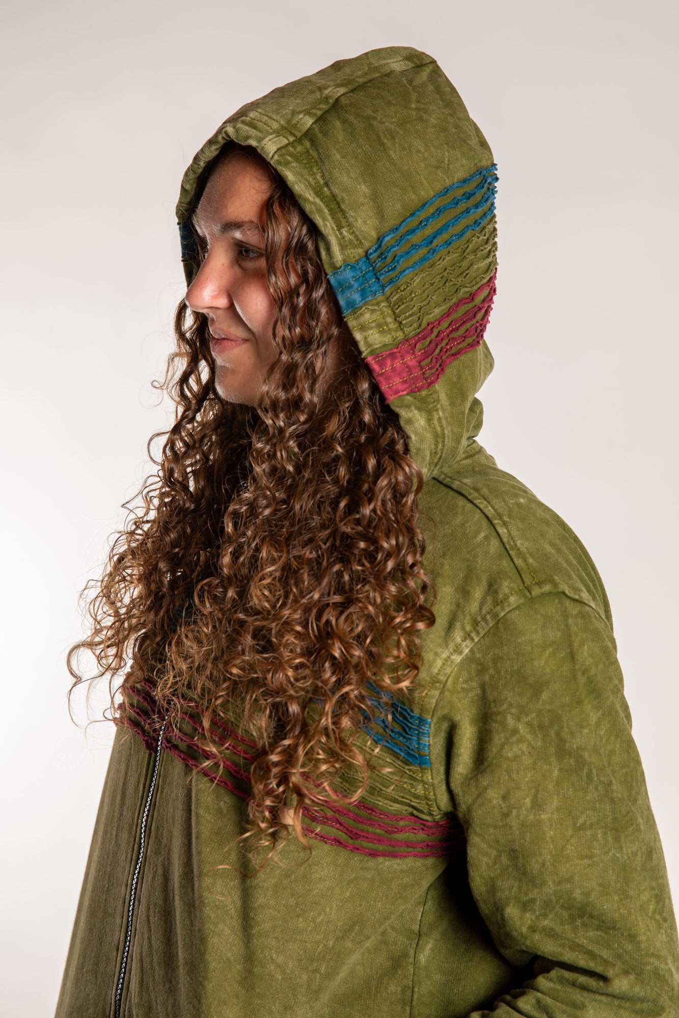 Emily is wearing the Olive Sathi Stripe ZIp Hoodie in Small