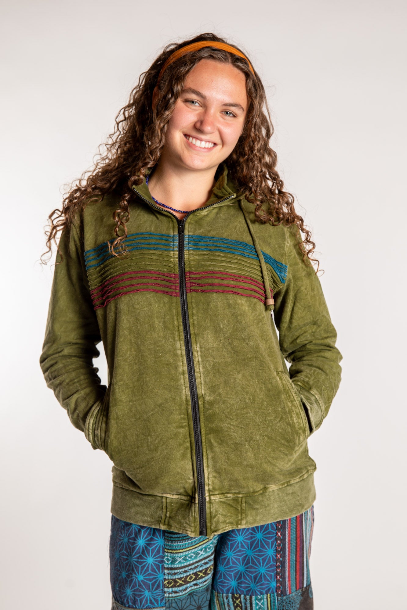 Emily is wearing the Olive Sathi Stripe ZIp Hoodie in Small