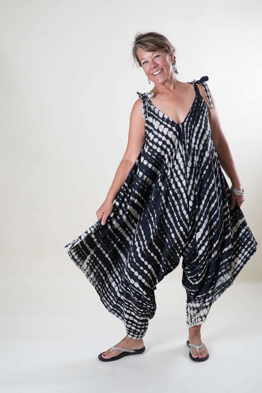 Jane is wearing a tie dye jumpsuit in black