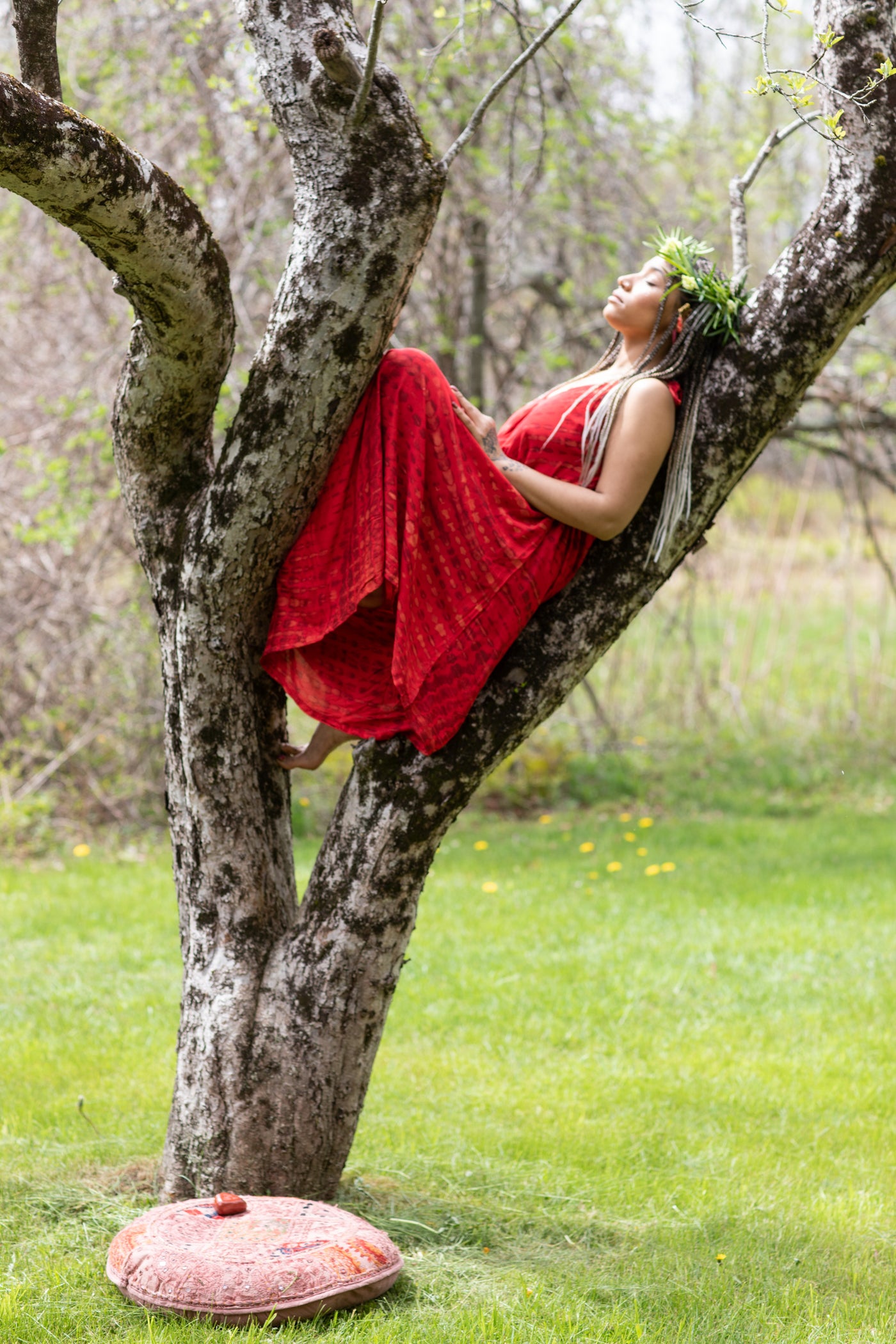 Tenessa is wearing a tie dye jumpsuit in crimson