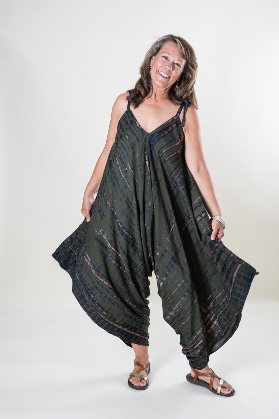 Jane is wearing a tie dye jumpsuit in green