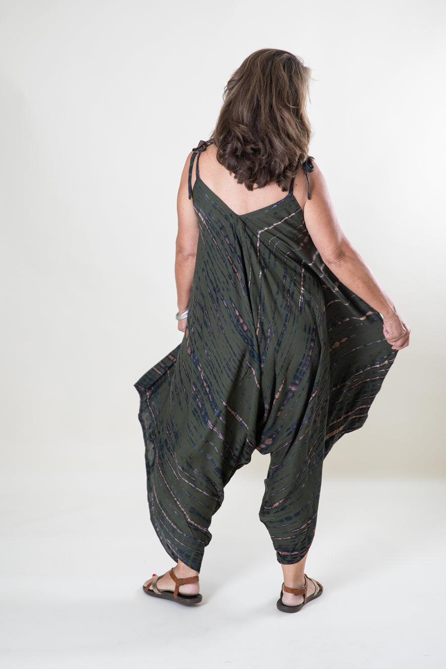 Jane is wearing a tie dye jumpsuit in green
