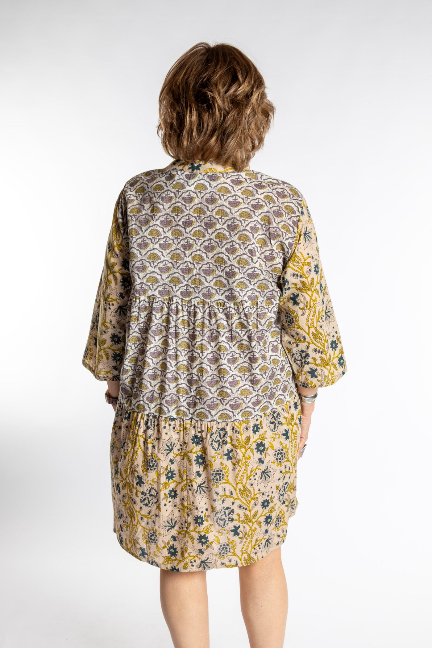 Betty is wearing the one size Shivani Tonal Cotton Tunic in Tan