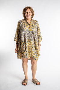 Betty is wearing the one size Shivani Tonal Cotton Tunic in Tan