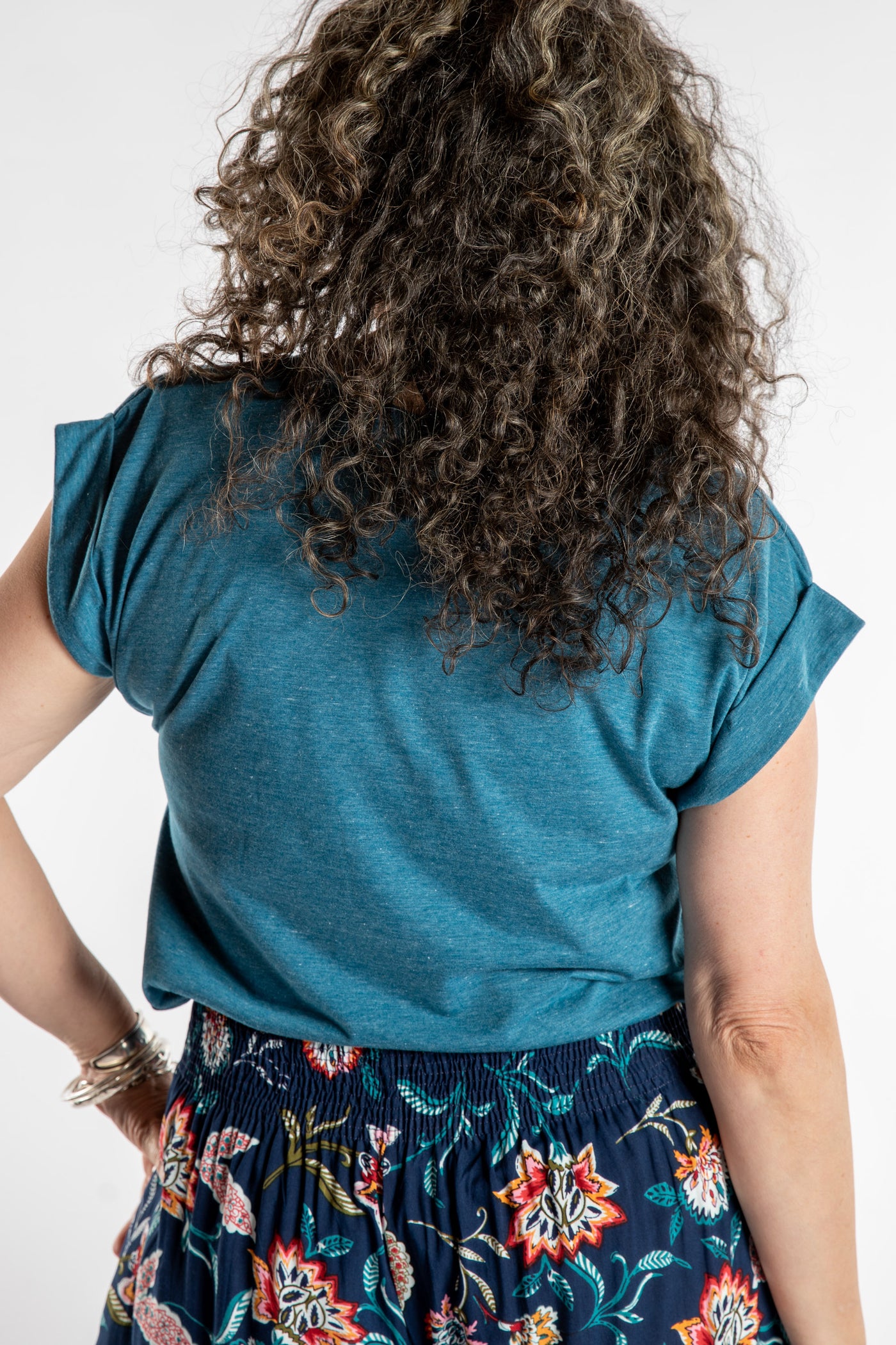 Susan is wearing the Smooth Sailing T in Teal in M/L