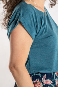 Susan is wearing the Smooth Sailing T in Teal in M/L
