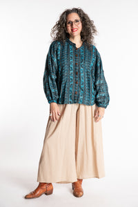 Susan is wearing the One Size Soft Brushed Stripe Top in Turquoise
