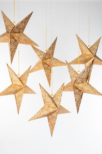 boho star decoration pack in gold on white background