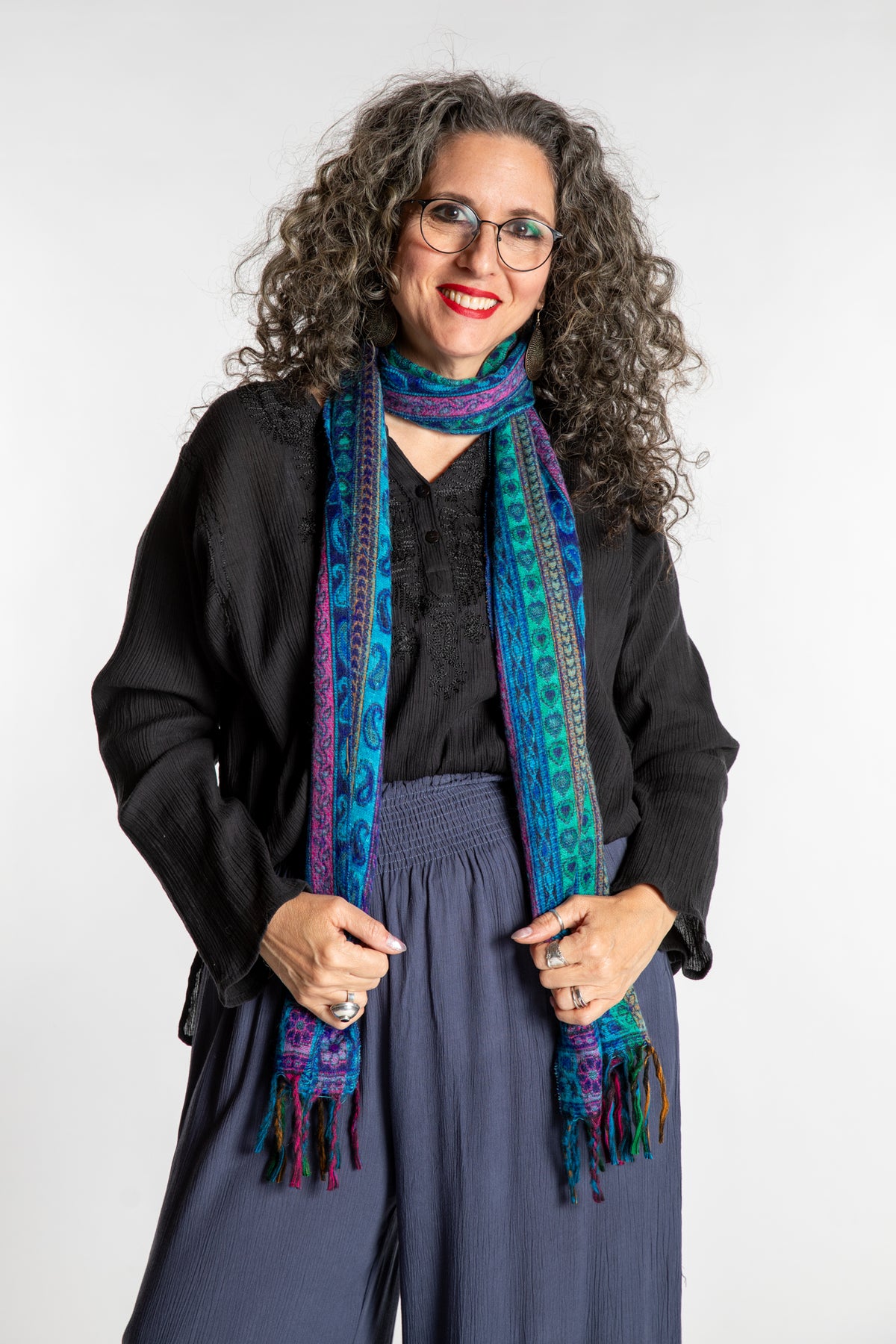 Susan is wearing the Striped Soft Brushed Scarf in Blue