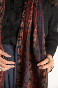 Susan is wearing the Striped Soft Brushed Scarf in Brown