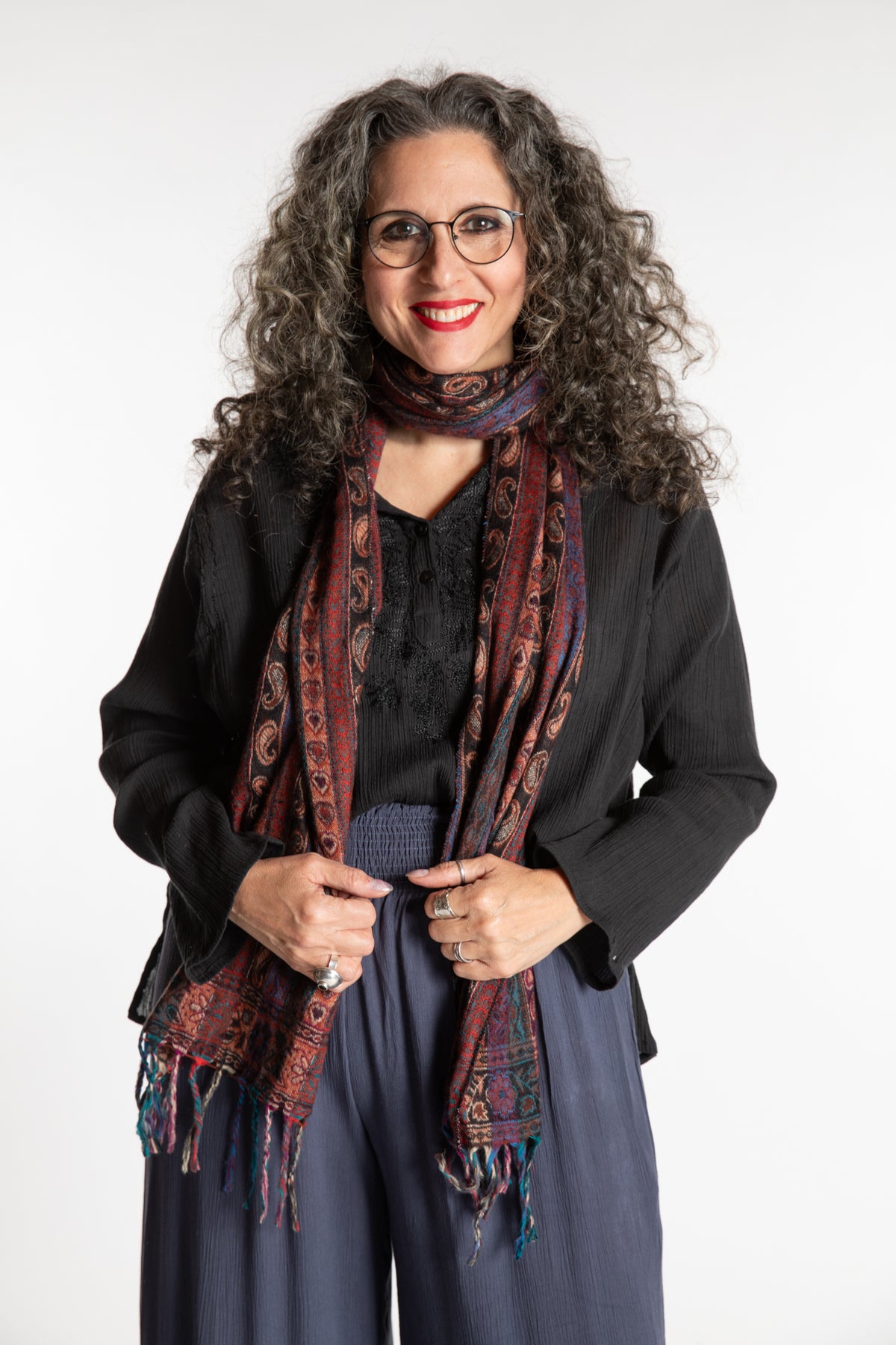 Susan is wearing the Striped Soft Brushed Scarf in Brown