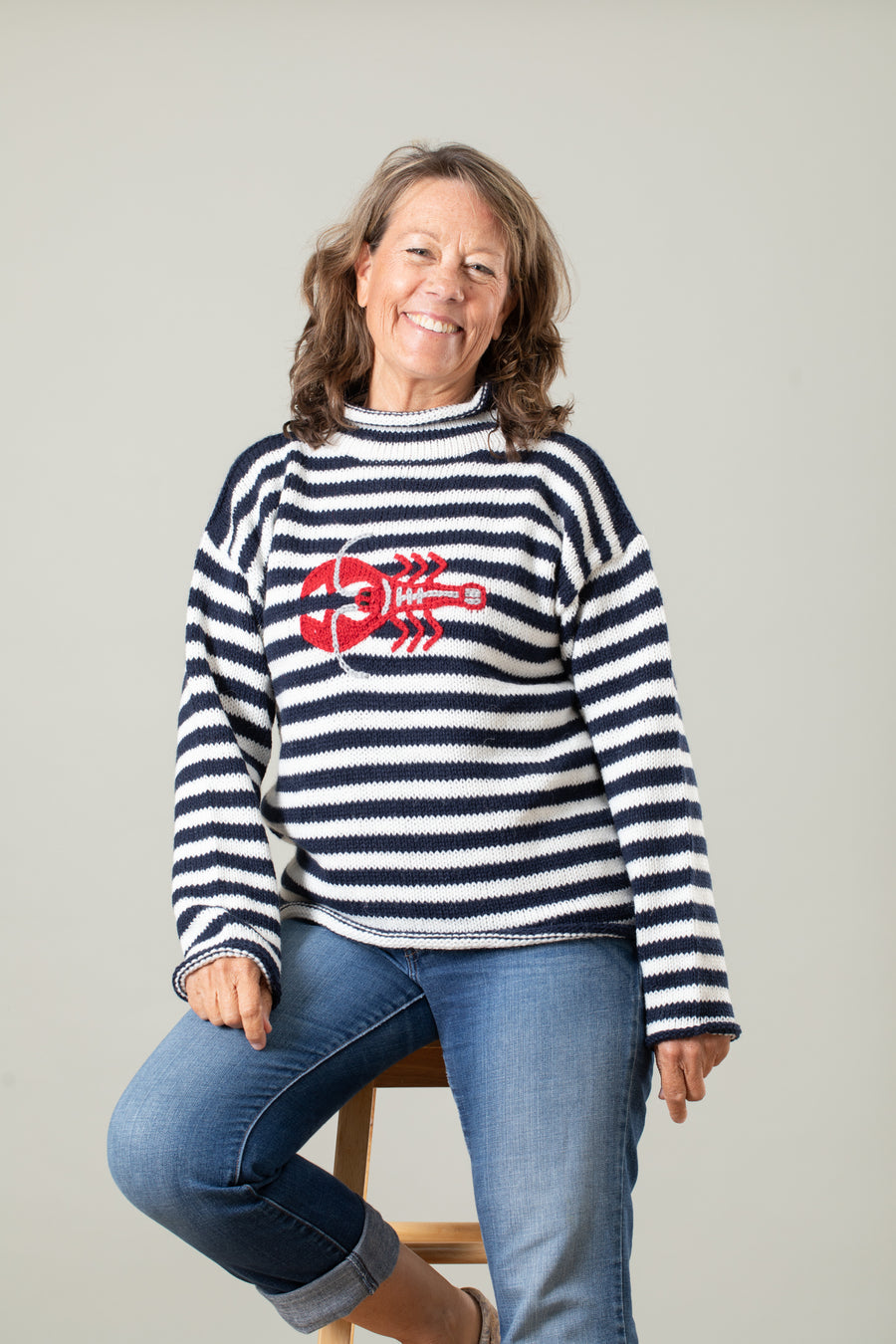 Jane is wearing size M striped lobster alpaca sweater 