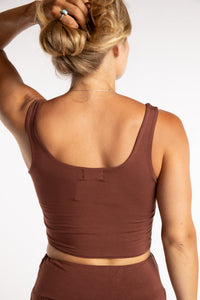 Sophie is wearing size S/M tank top in Brown
