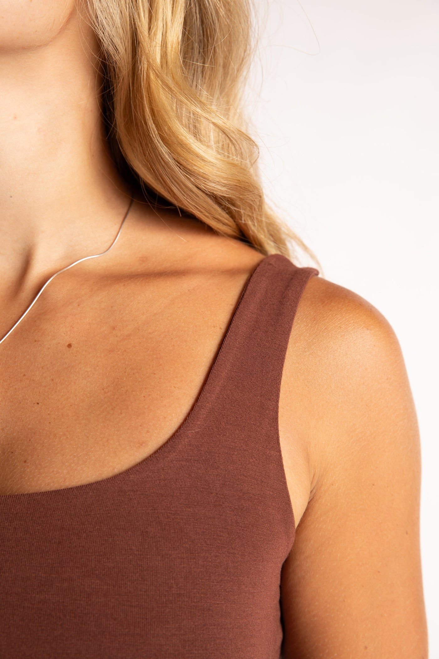 Sophie is wearing size S/M tank top in Brown
