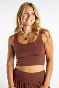 Sophie is wearing size S/M tank top in Brown