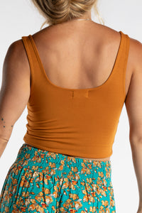 Sophie is wearing size S/M tank top in Yellow Mustard